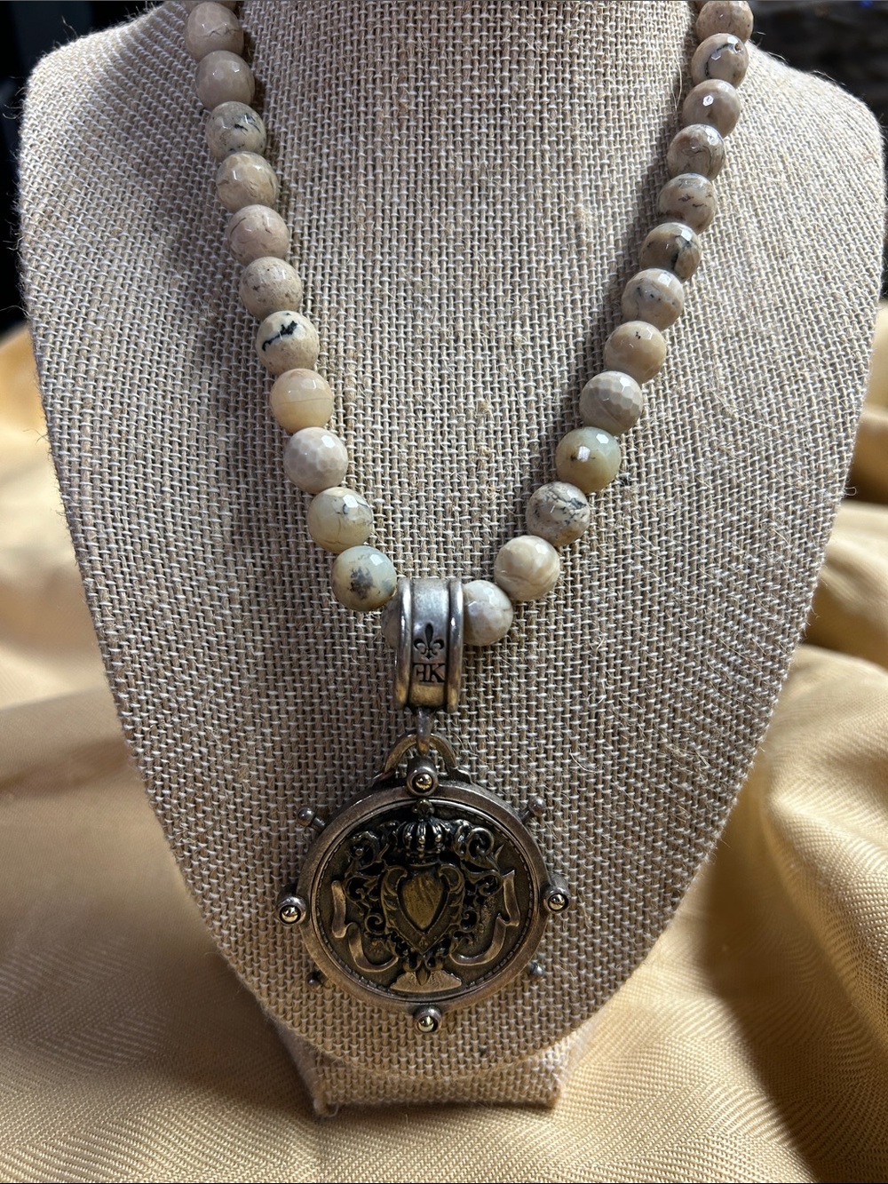 French Kande Beaded Neutral Stone Necklace with Ornate Silver-Tone Medallion